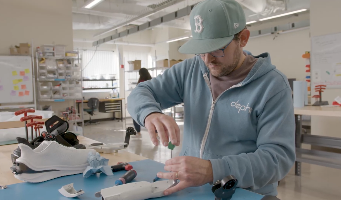 A Dephy engineer assembling a Sidekick unit in the lab